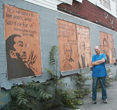 Scott Schaeffer-Duffy with his murals, Worcester